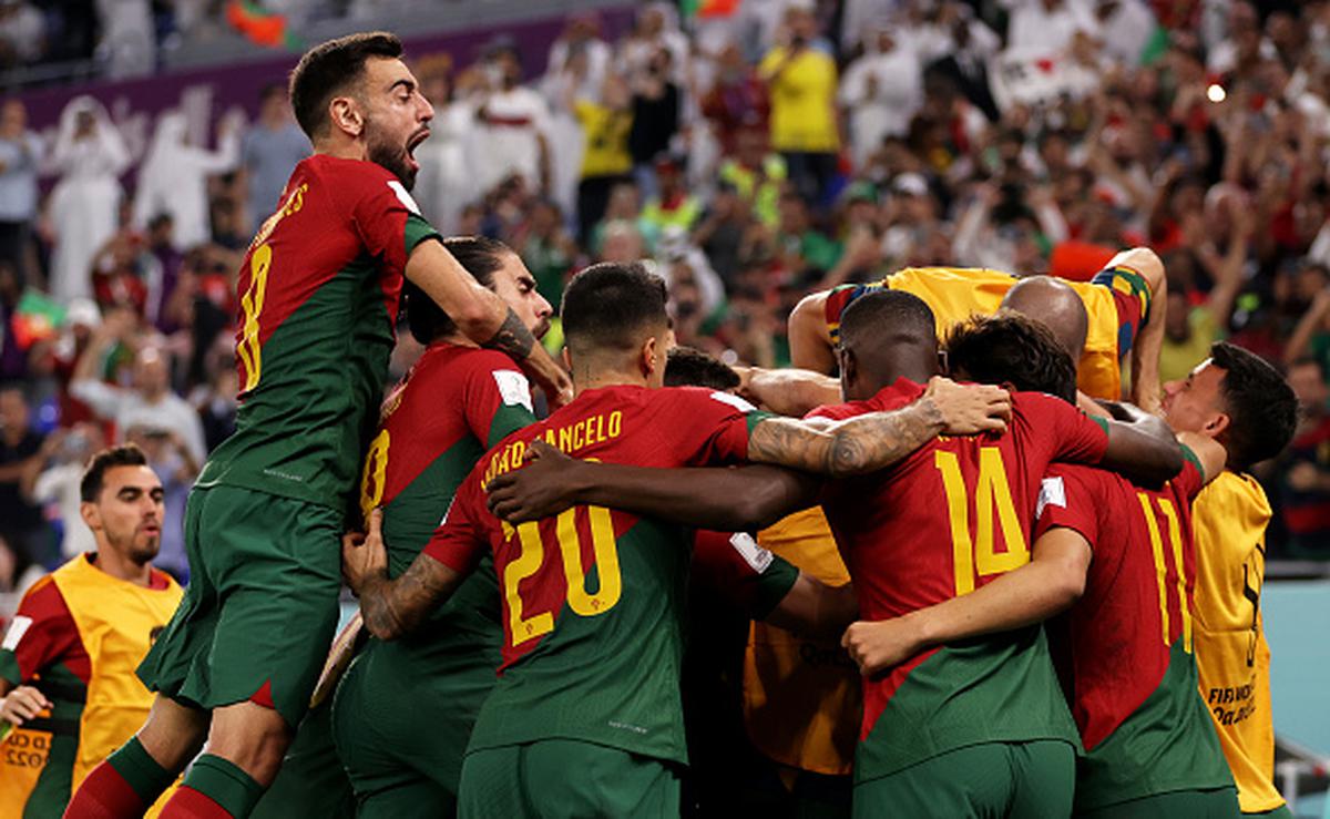 Portugal advances to the last 16 when Fernandes scores twice against Uruguay.
